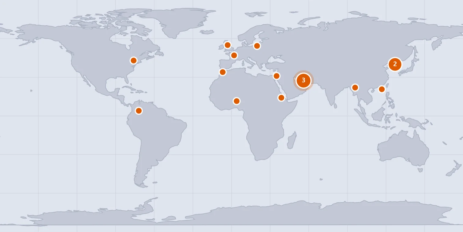 A world map with orange pins marking where the day's news stories happened